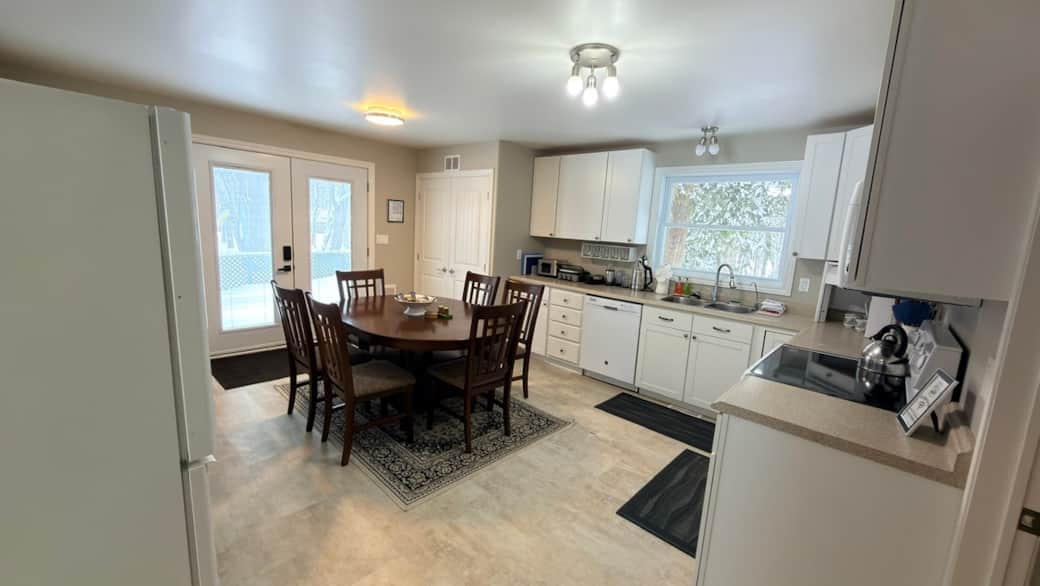 Modern kitchen setup with toaster, griddle, blender, dishwasher, and everything you need for cooking