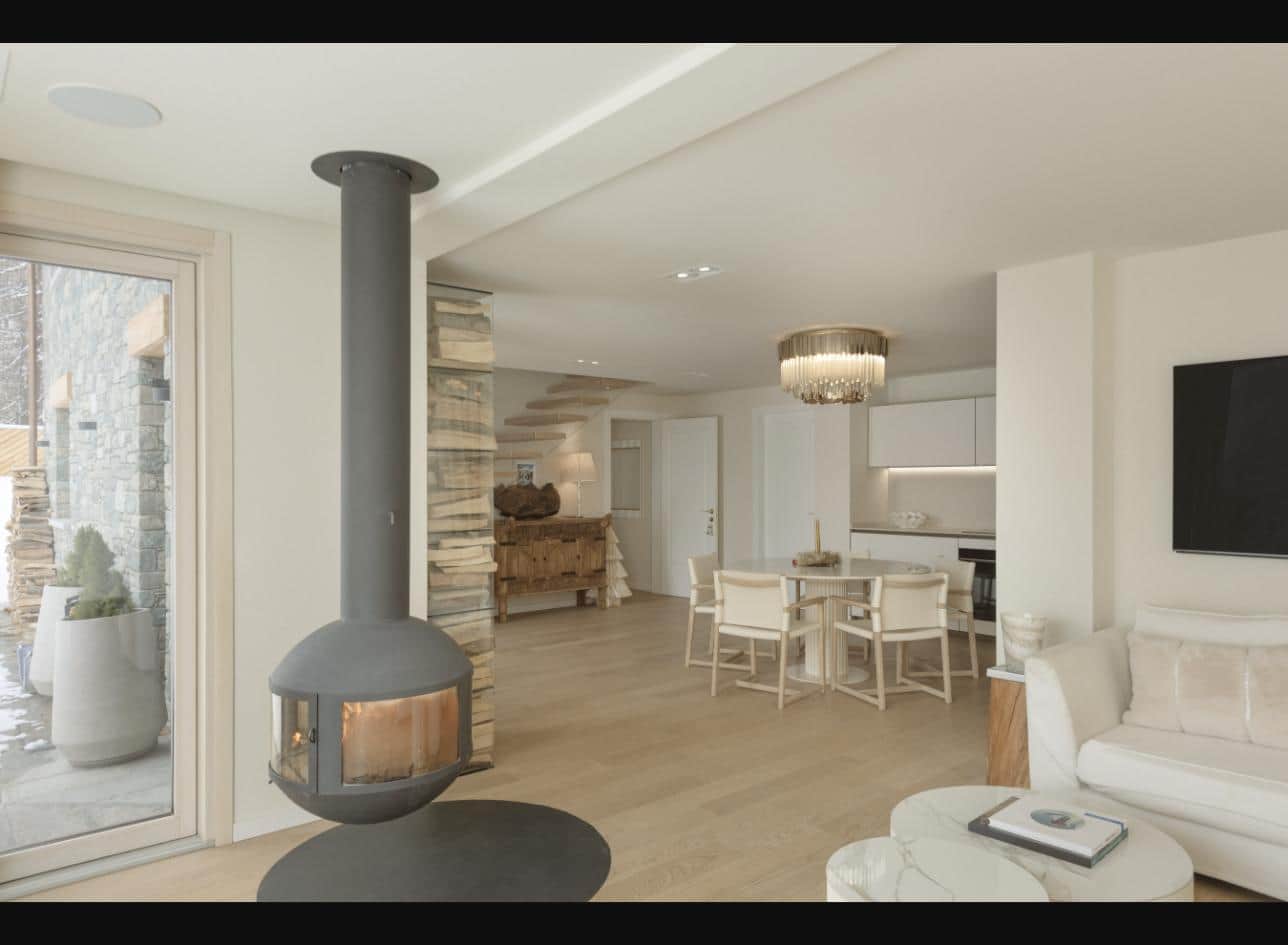 Open-plan living and dining area with fireplace and designer kitchen