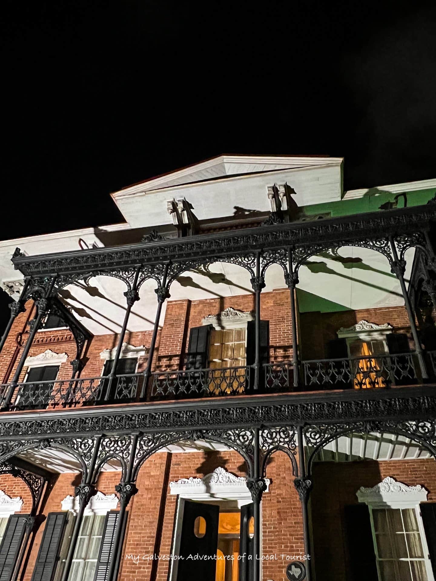 Ghost Tours of Galveston Island night walking tour with historic buildings in the background