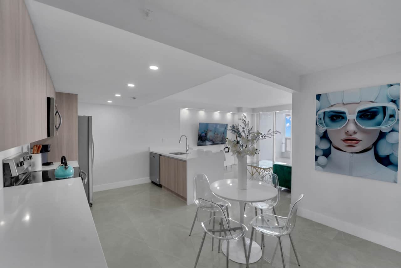 Dining area, fully equipped kitchen, living area with Roku streaming tv, balcony access