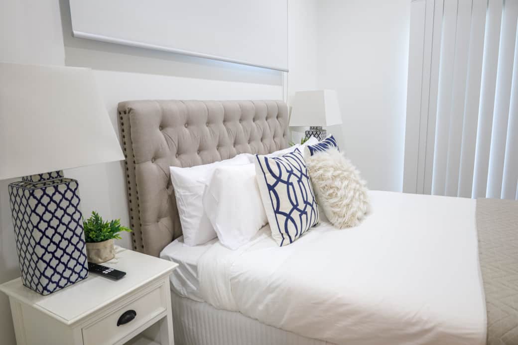 Quality bedding and luxe decor create a cozy, elegant retreat for rest and relaxation.