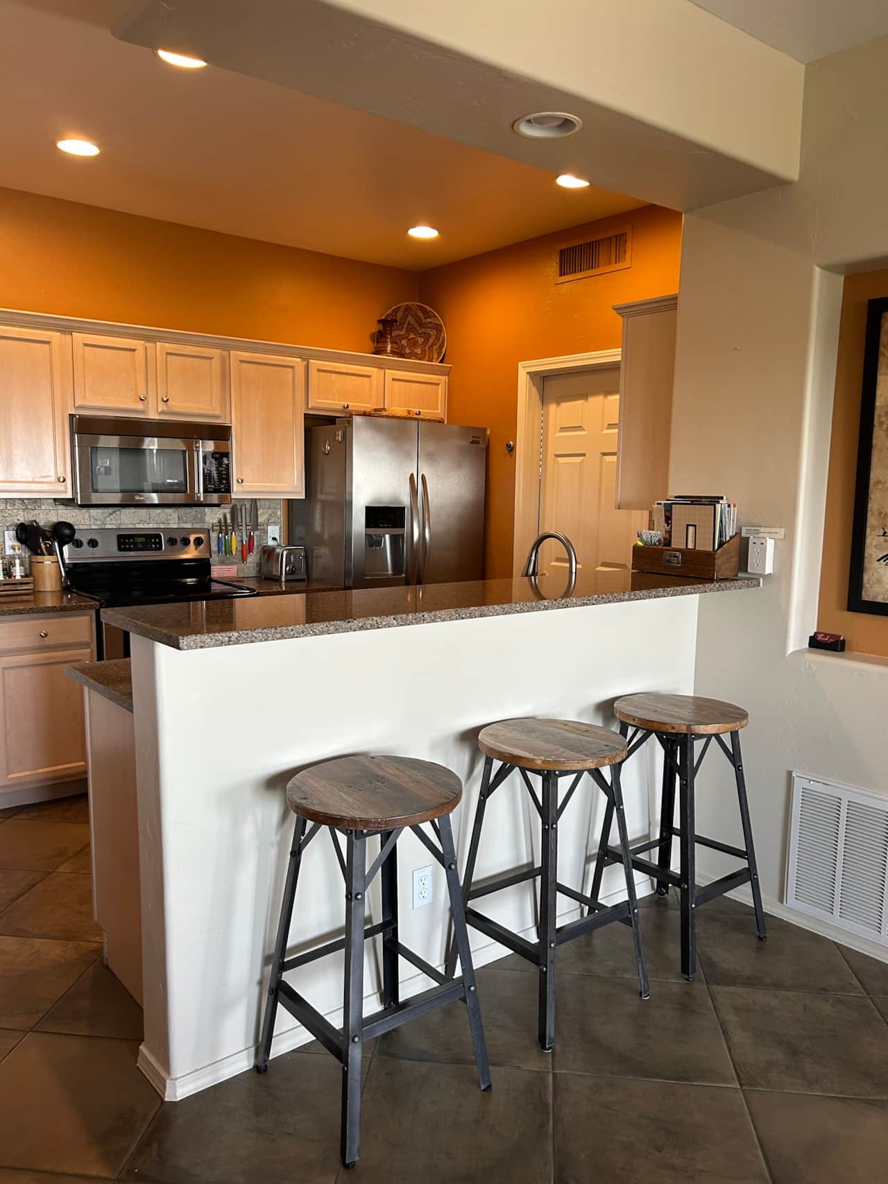 Kitchen/bar area opens to living area