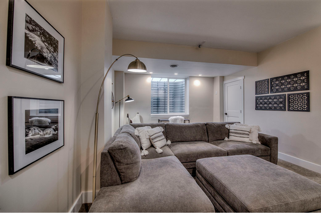 basement entertainment room with couch and 65” tv basement entertainment room with couch and 65” tv