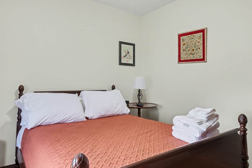 Orange Room - Full size bed, storage in the built-in shelves, Roku TV and power for your devices.