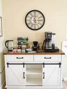The fully equipped coffee station with a dual drip/pod coffee maker as well as a hot water kettle.  