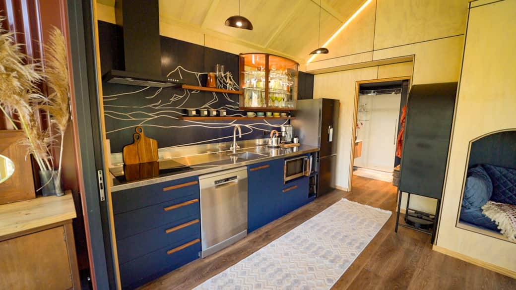 Hand-built kitchen with recycled timber and modern design at Cascade Cabin Waitomo NZ Hand-built kitchen with recycled timber and modern design at Cascade Cabin Waitomo NZ