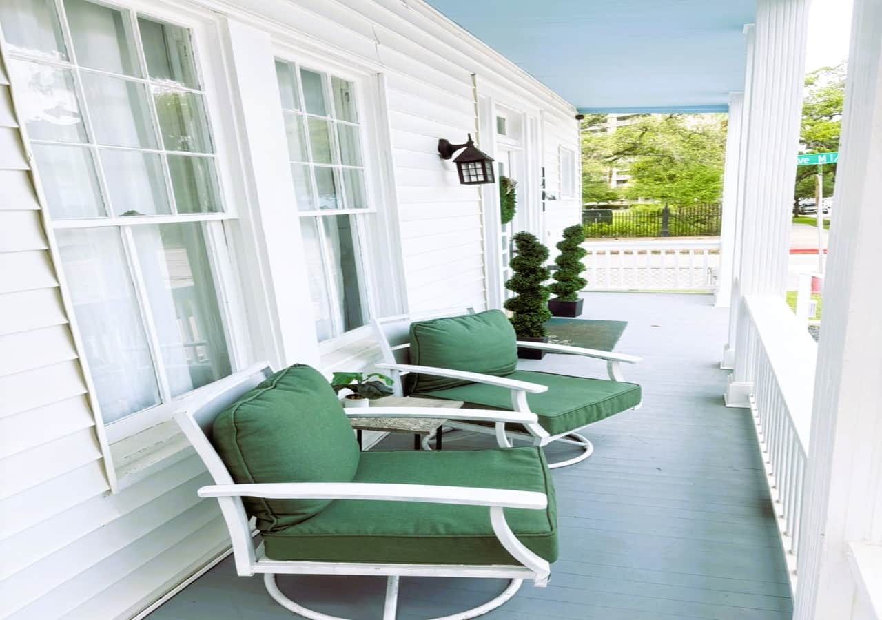 come and relax in swivel chairs on the front porch.