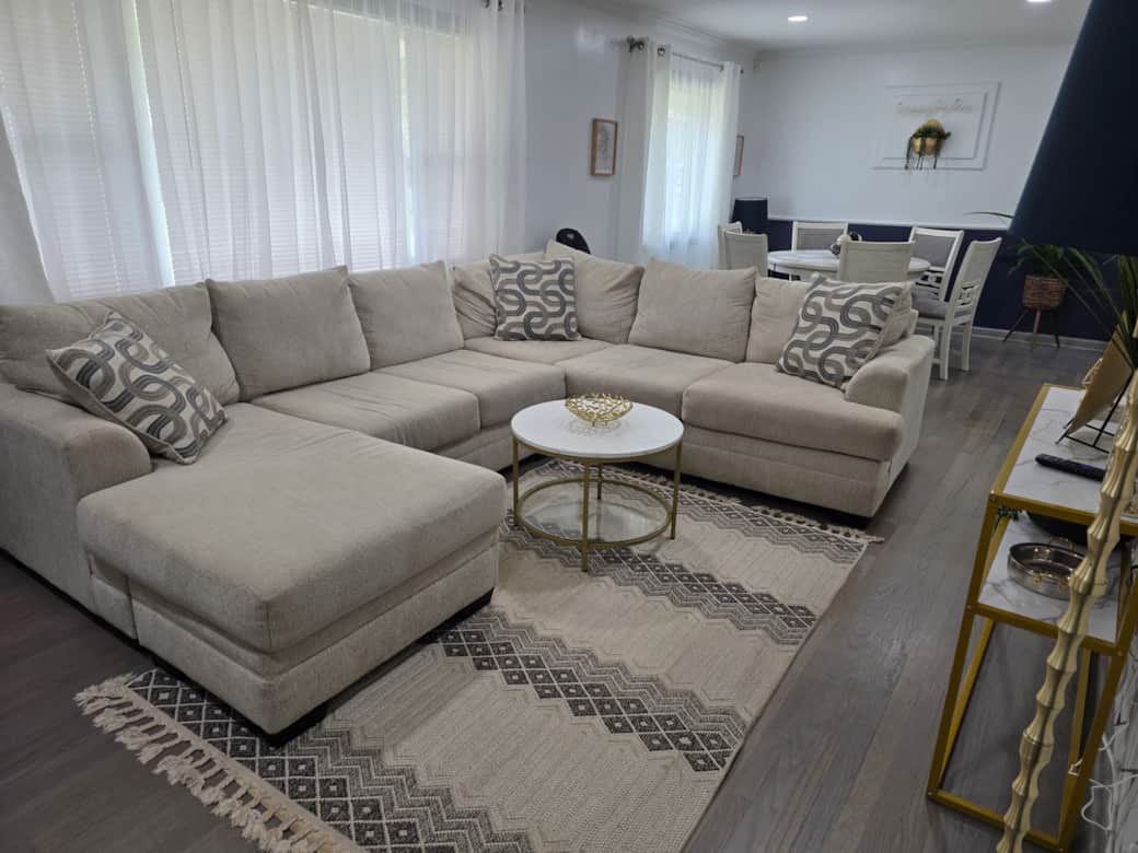 Modern, inviting living room flows into dining area-the perfect space for relaxing or entertaining Modern, inviting living room flows into dining area-the perfect space for relaxing or entertaining