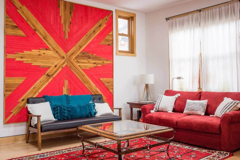 Bright and open living space with custom art work and a gas fireplace