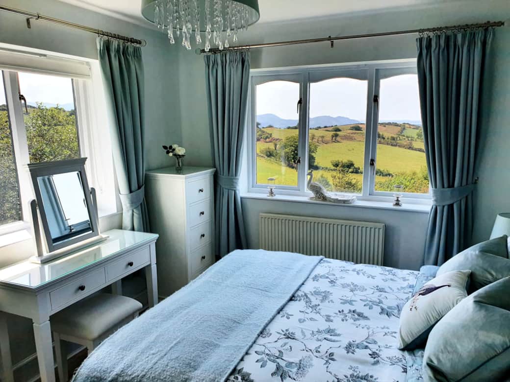 Bedroom 1 is dual aspect, with superb views