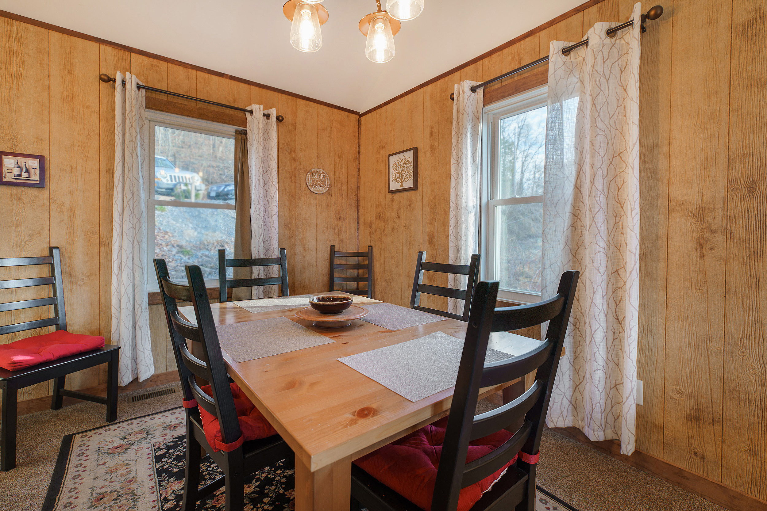 Dining table seats 4, but can be expanded by adding table leaves in closet