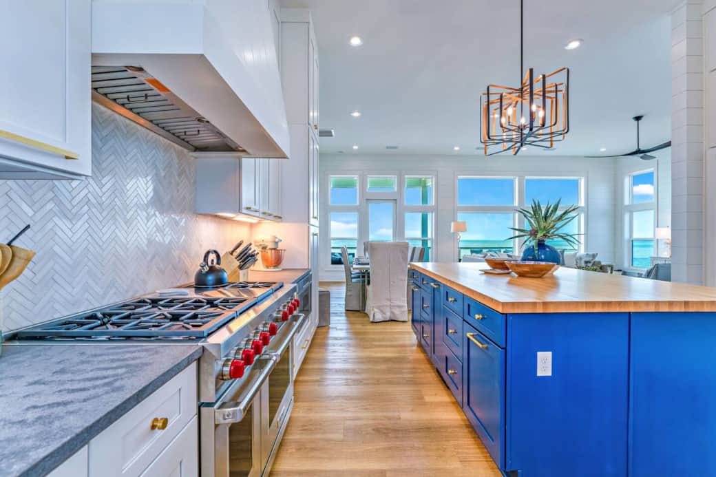 Cook on Wolf gas cooktop with double ovens. Cook on Wolf gas cooktop with double ovens.