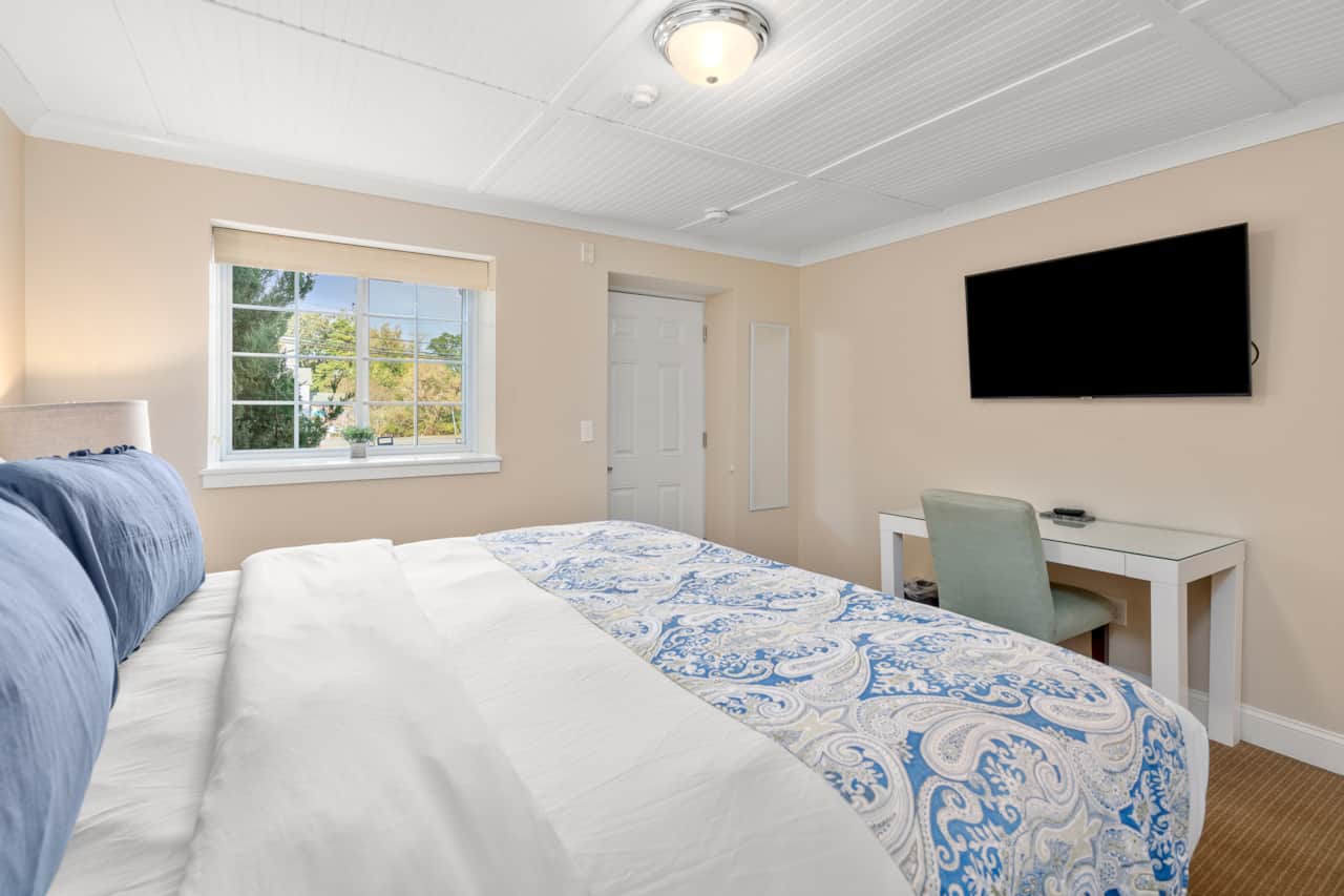 King bed with a dedicated workspace, clean linens, and cable tv!