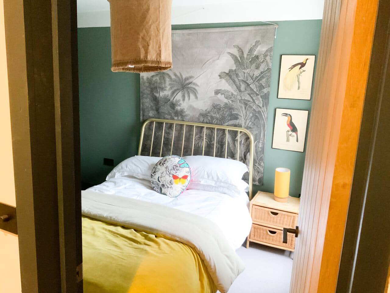 Double bedroom with bedside cabinet and hanging storage