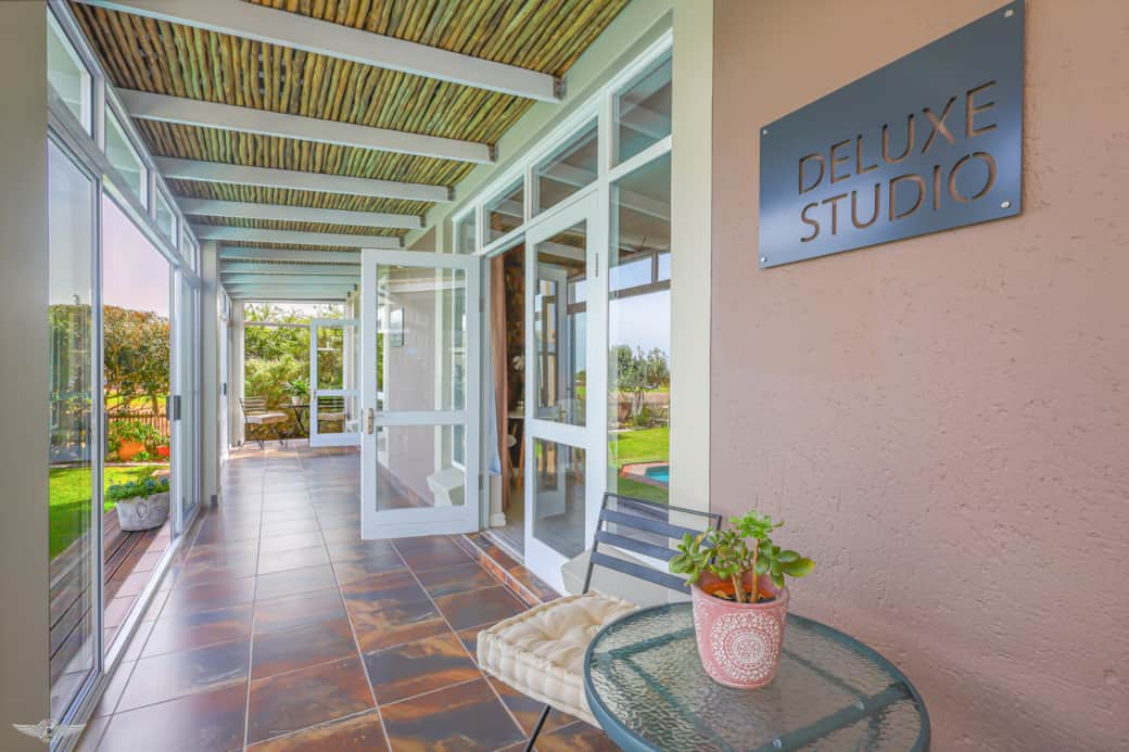 Shared Patio with Private Entrance Overlooking Pool