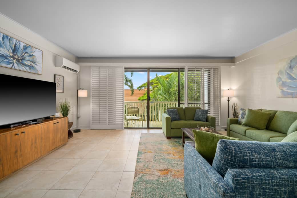 Light-filled lounge with cozy seating and easy access to the private lanai