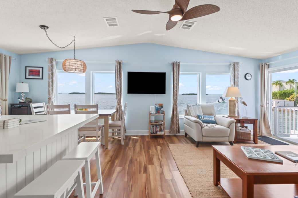 Living room & dining room with panoramic oceanfront views