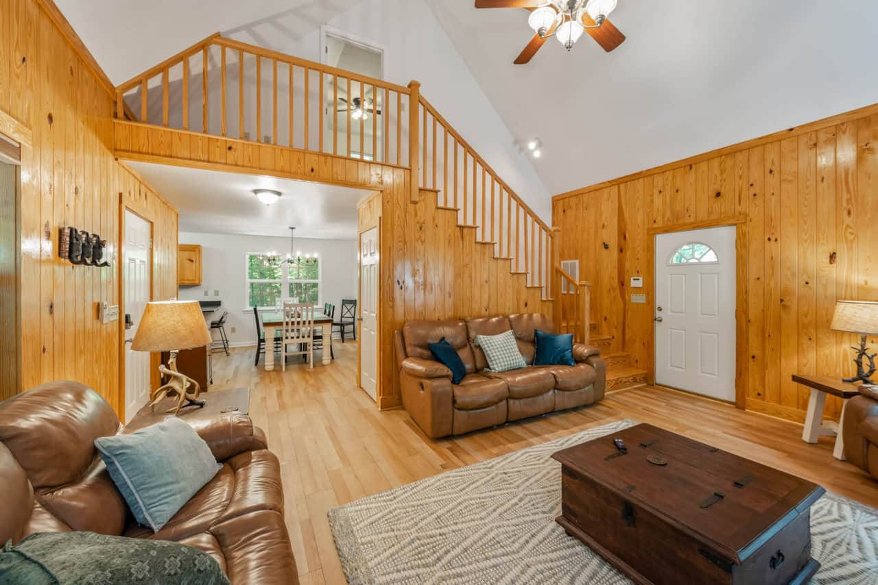 Comfortable open living spaces. Stairs up to second bedroom.