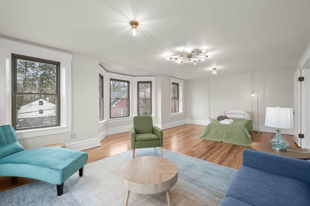 Living Room has a single bed for a friend.