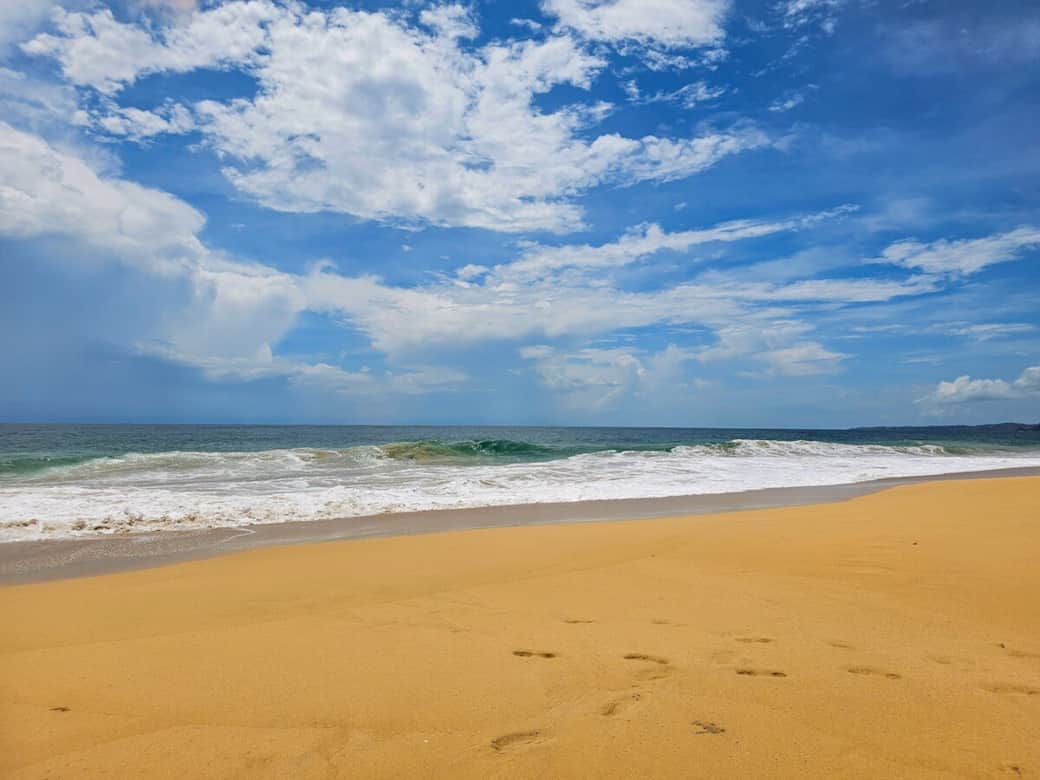 Bluff Beach in Bocas del Toro with its signature orange sand and rolling Caribbean waves. Wide open shoreline, blue skies, and powerful surf just steps from the house.
