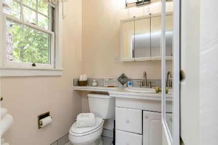 Spacious bathroom with whirlpool hot tub. 
