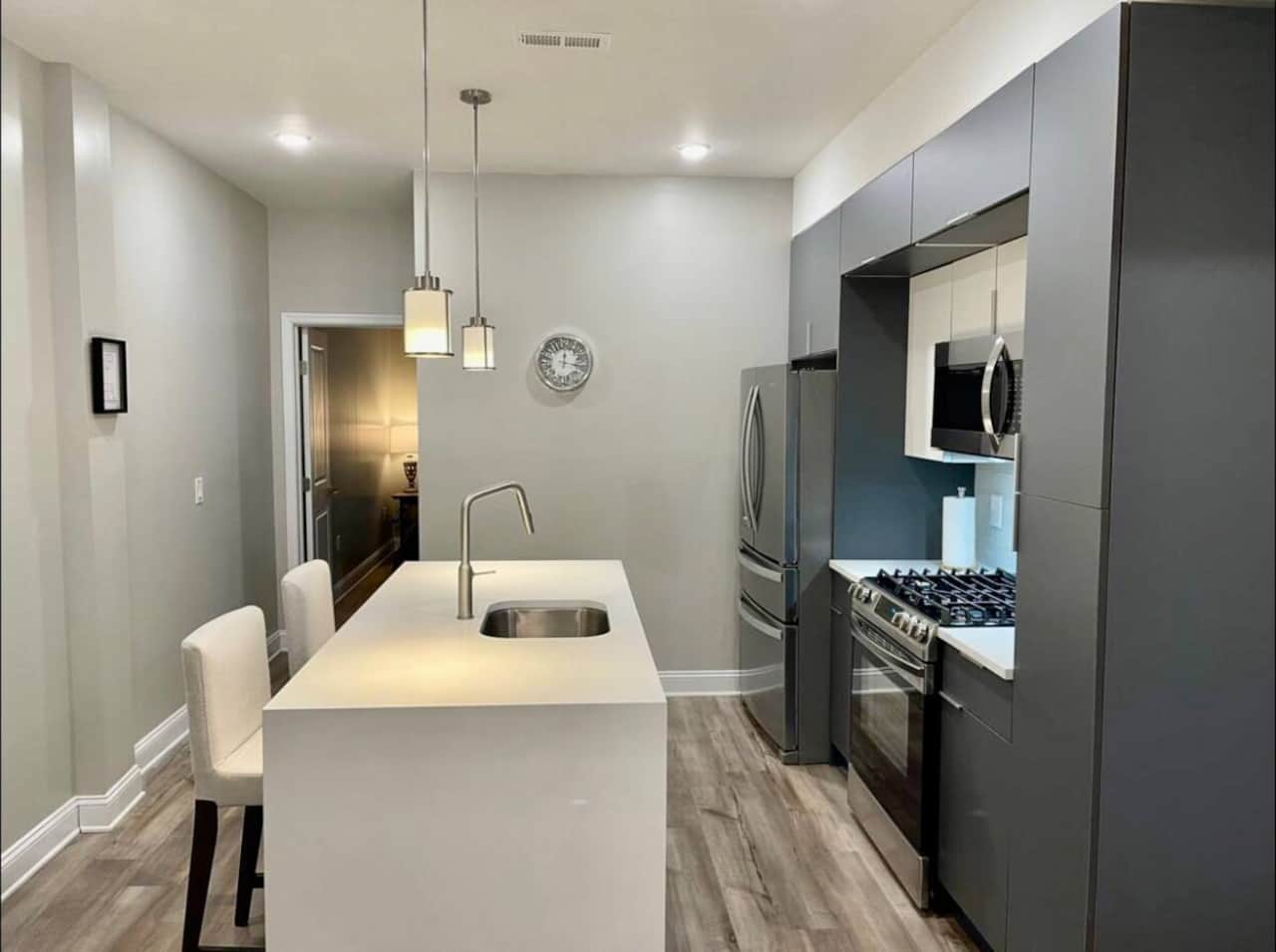 Full kitchen with all the amenities and waterfall breakfast bar.