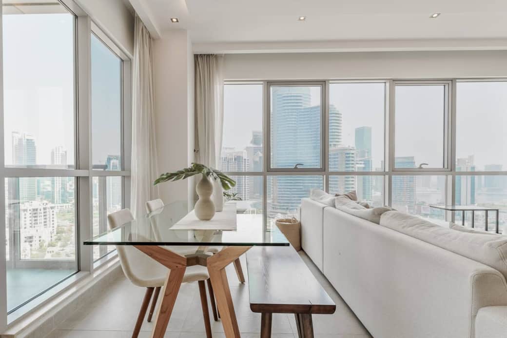 Contemporary dining area with a sleek table and seating great for family meals in a sophisticated setting.