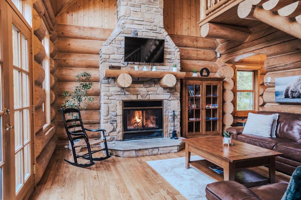 Large, bright living room with wood-burning fireplace