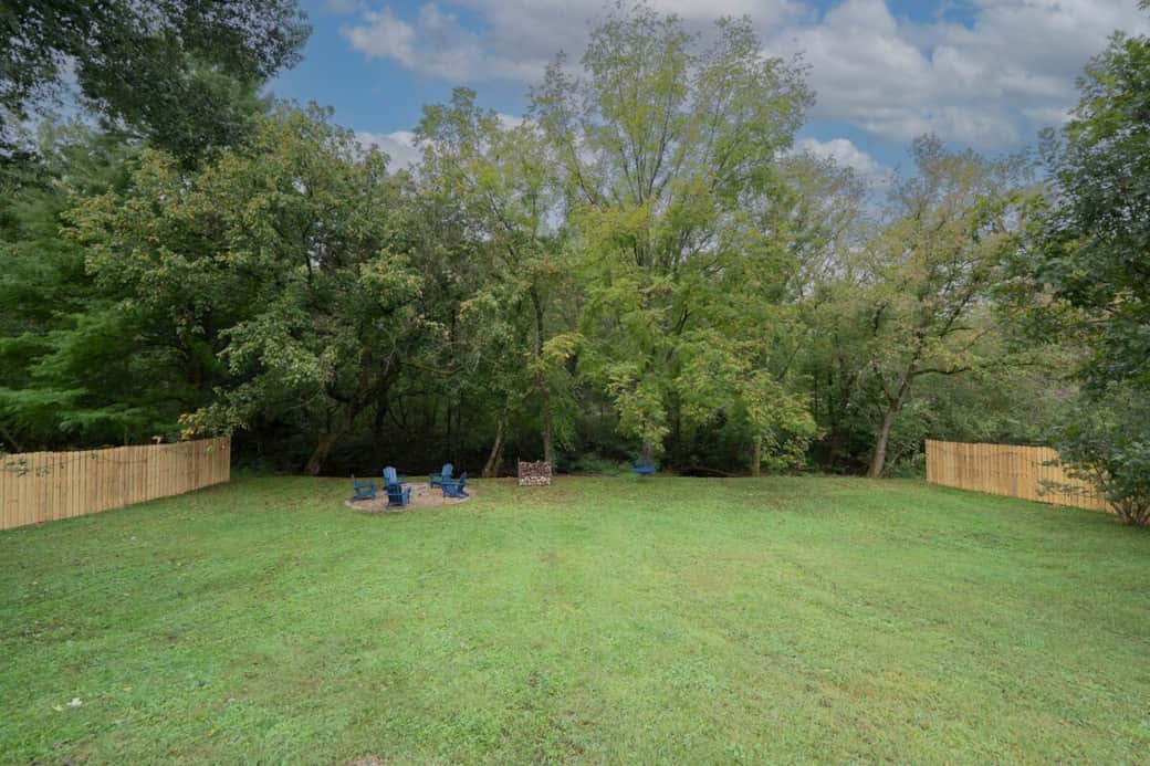 The back yard is a private oasis that is fenced and surrounded by rope lighting at night. The kids will love to run around in the big back yard. The blue round tree swing is so fun, my kids have spent hours playing on it and so will yours. The back yard is a private oasis that is fenced and surrounded by rope lighting at night. The kids will love to run around in the big back yard. The blue round tree swing is so fun, my kids have spent hours playing on it and so will yours.