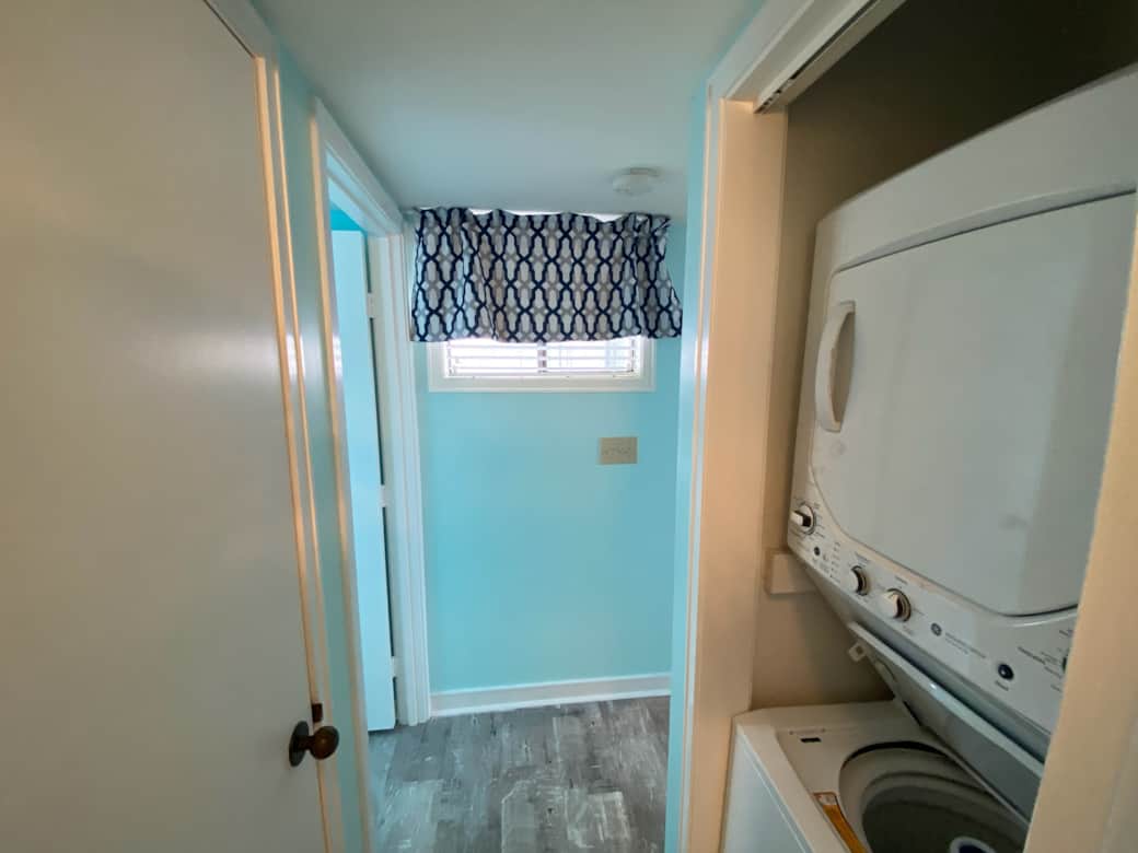Washer/dryer looking out from the second bathroom