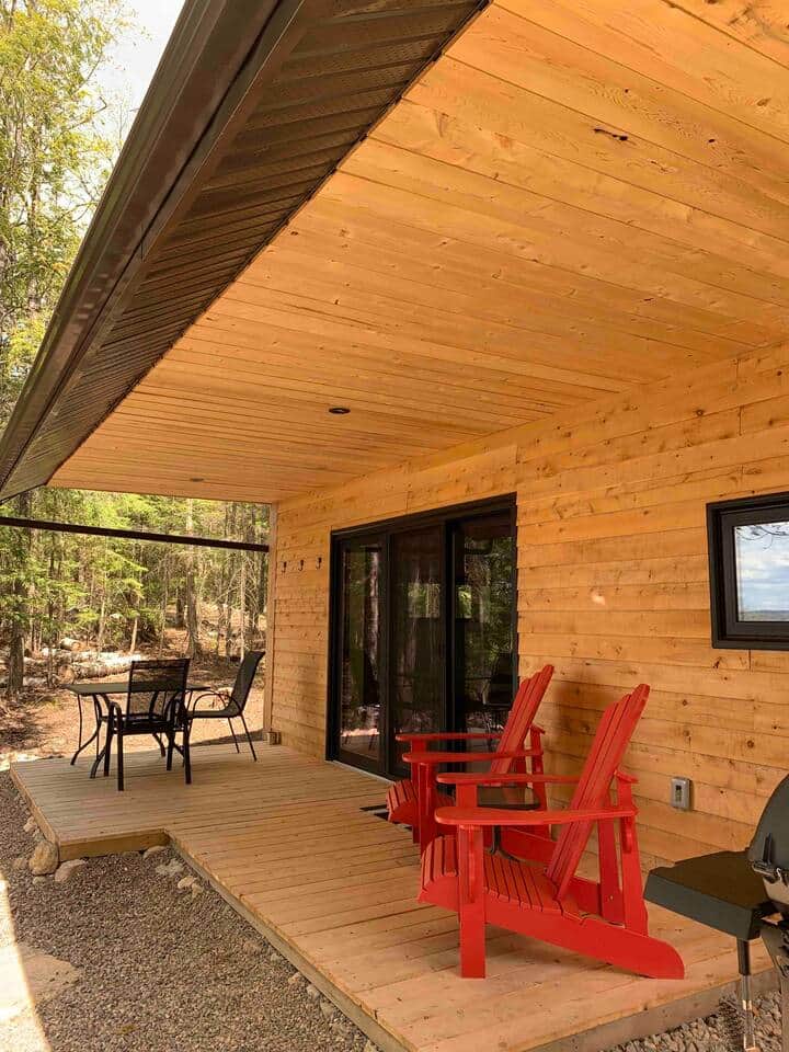 Covered deck, allows you to be outside rain or shine with stunning lake, and Forest view
