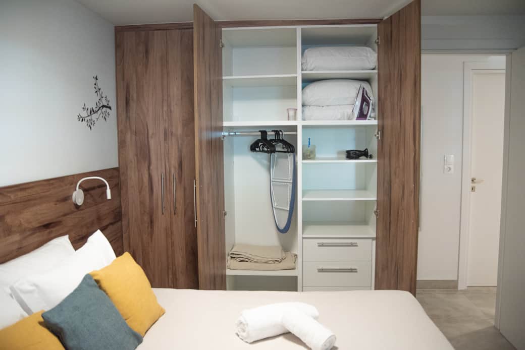 Bedroom king size bed open wardrobe 