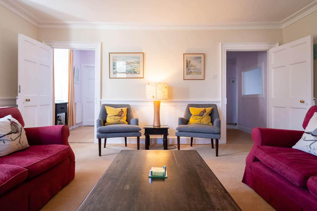Apartment living room with armchairs and soft seating