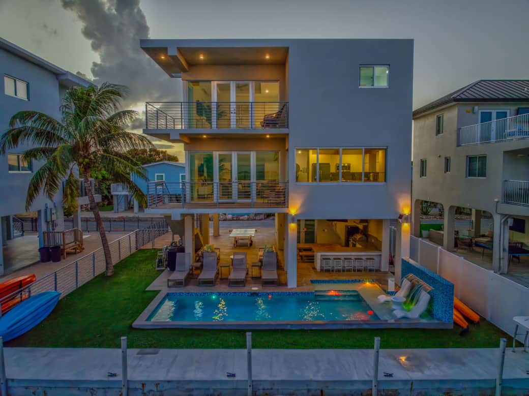 Sunset Aerial view of the home and pool Sunset Aerial view of the home and pool