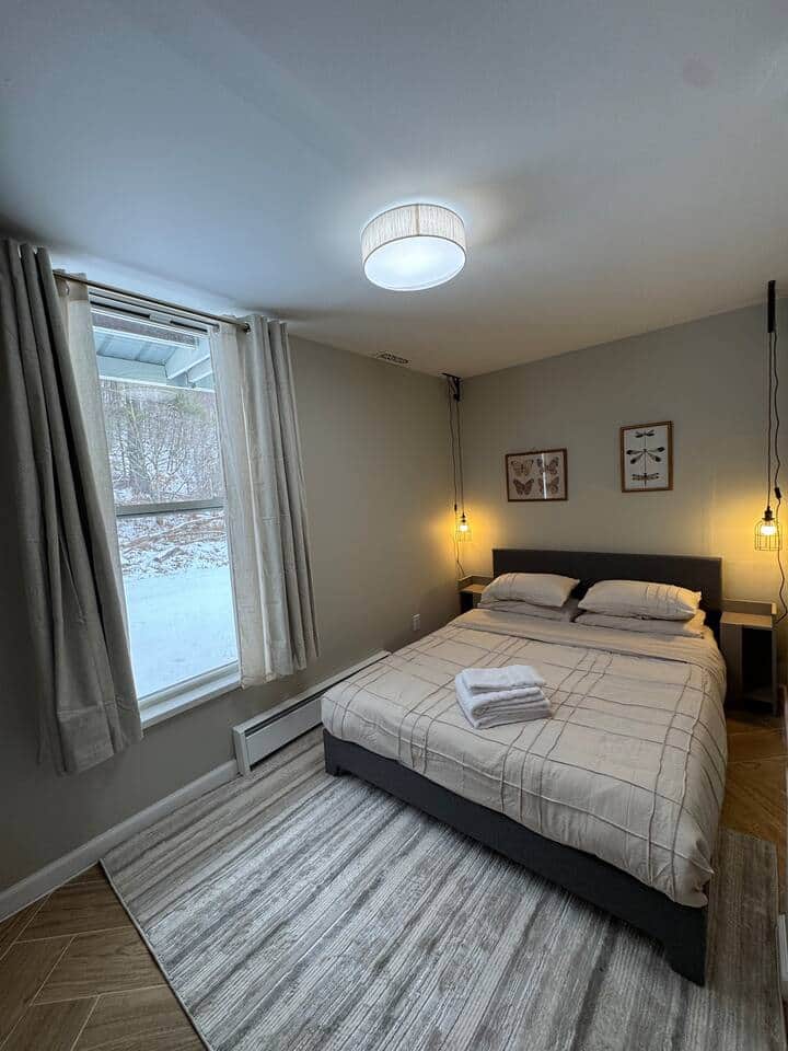 Queen bed with bedside lighting 