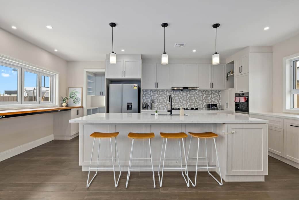Cook like a pro in our spacious kitchen, equipped with a large island for meal prep and casual dining. The modern appliances and ample counter space make cooking a breeze. Gather around the island for a quick breakfast or a lively dinner party.