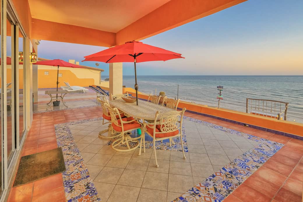 Expansice beachfront terrace view of the Sea of Cortez during sunset.