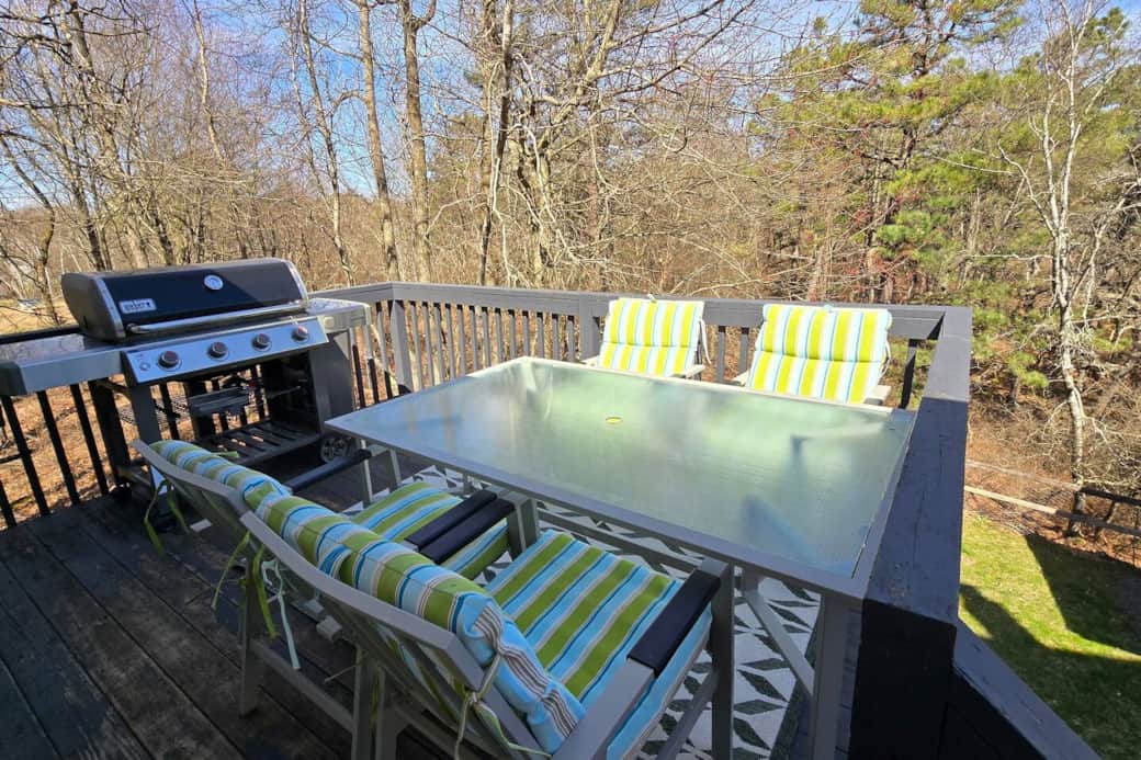 Grill with sitting area. Grill has a propane tank attached Grill with sitting area. Grill has a propane tank attached