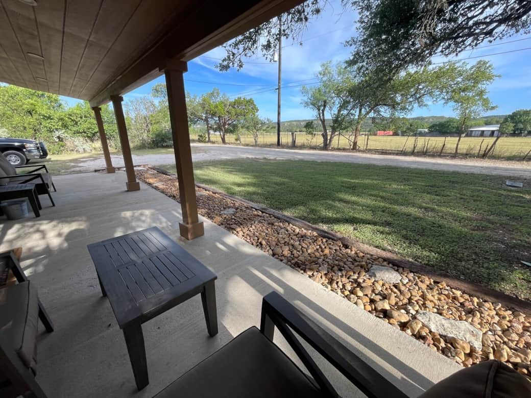 Relax on the covered porch and enjoy peaceful views of the Hill Country 