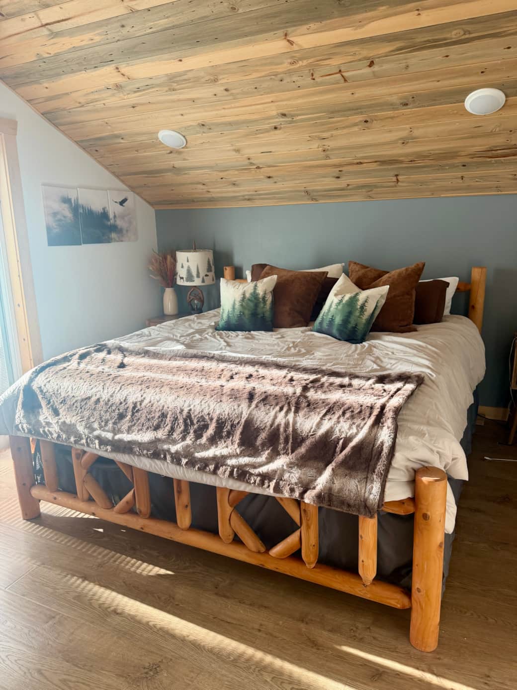 Lofted master suite with a King bed and private deck overlooking the lake