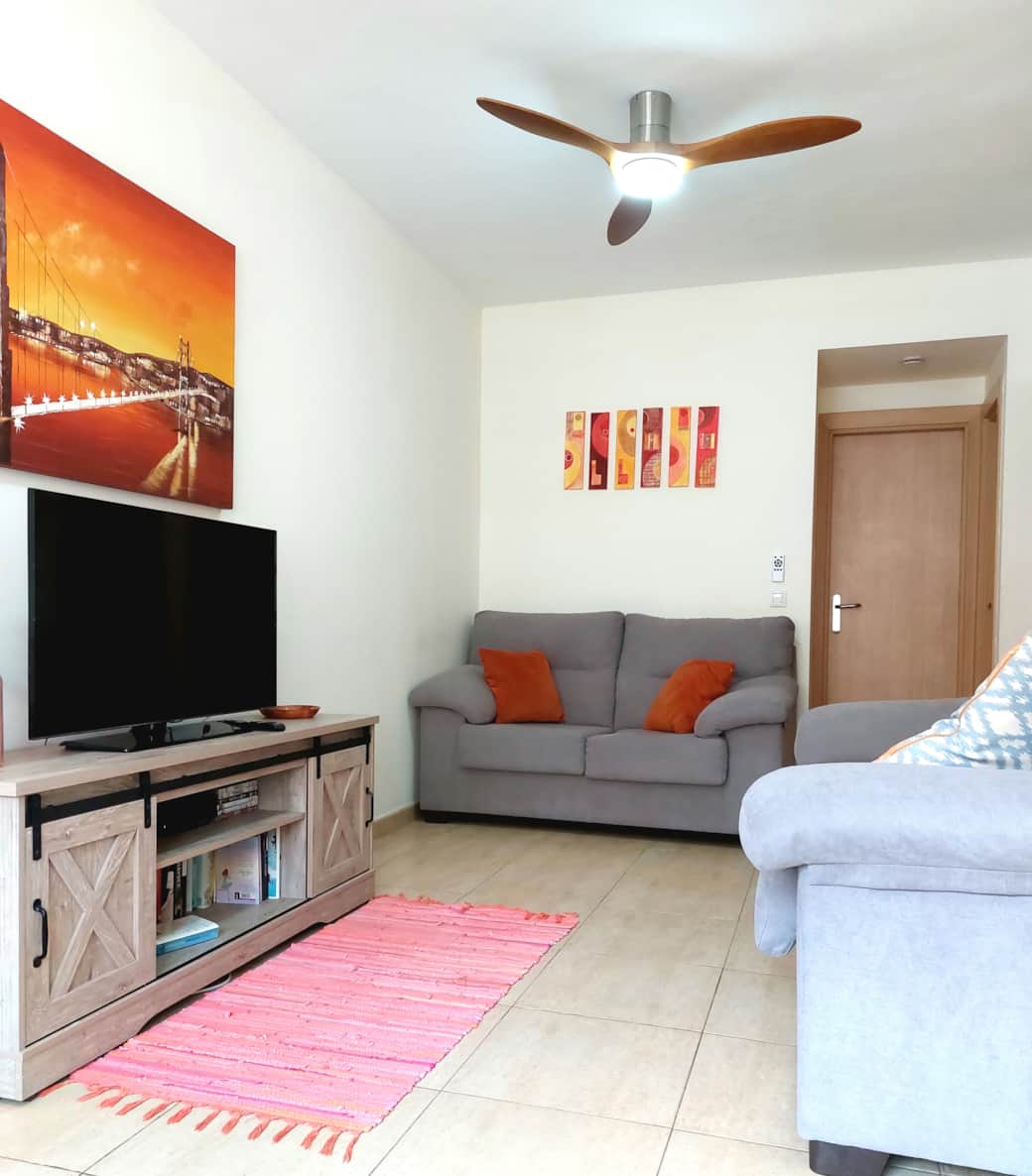 Spacious lounge at Litha House with comfy seating, free Wi-Fi, and Netflix access for your evenings