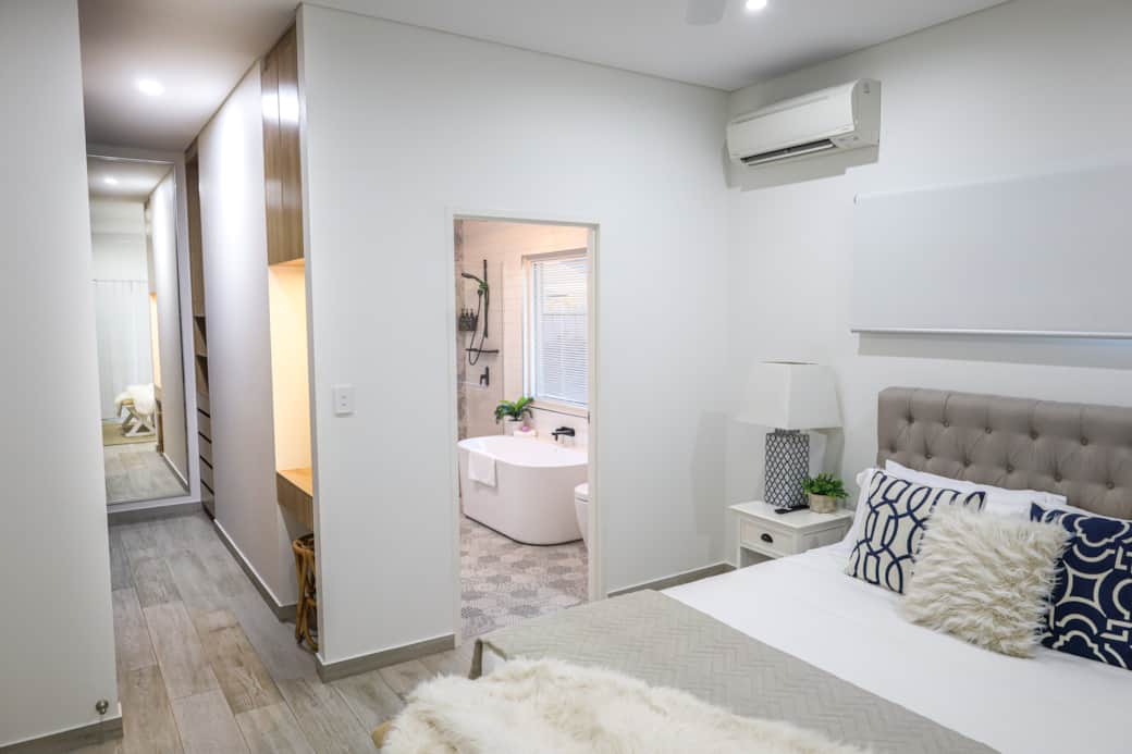 Master bedroom with luxurious ensuite and walk-in robe—your private haven of comfort and style.