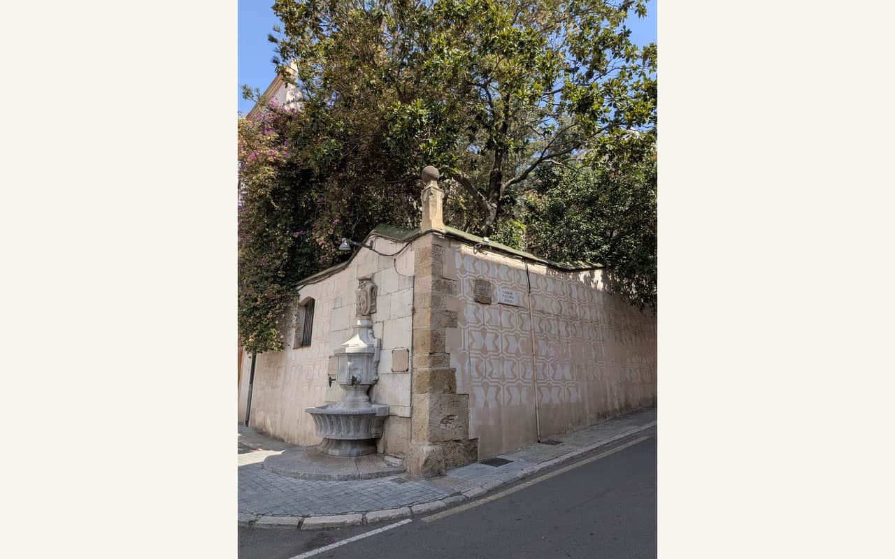 Old wall and fountain at Plaça de Sant Antoni in Tarragona