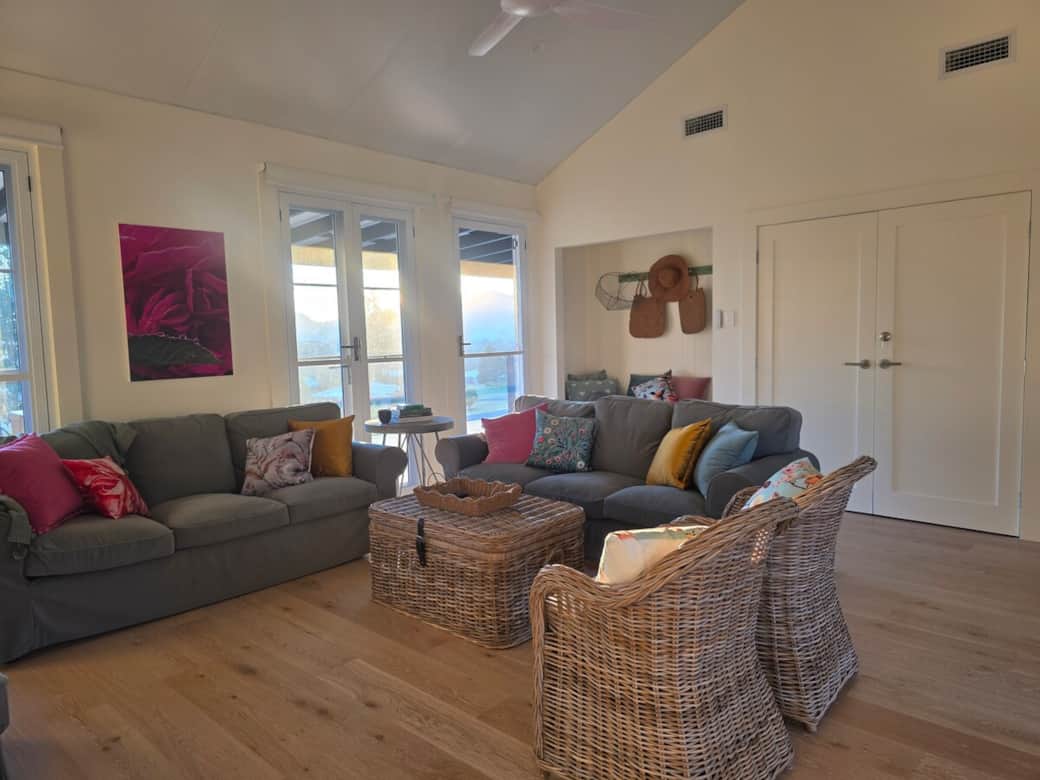 Living room with views of sunrise over Mograni mountains. Living room with views of sunrise over Mograni mountains.