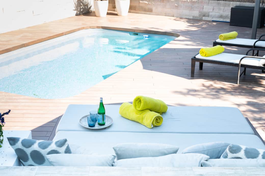 Sun loungers and pool area at Casa Guindilla holiday home in Portals Nous, Mallorca