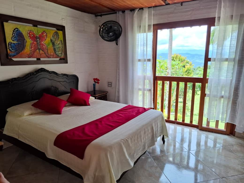 Modern queen en-suite with mountain views