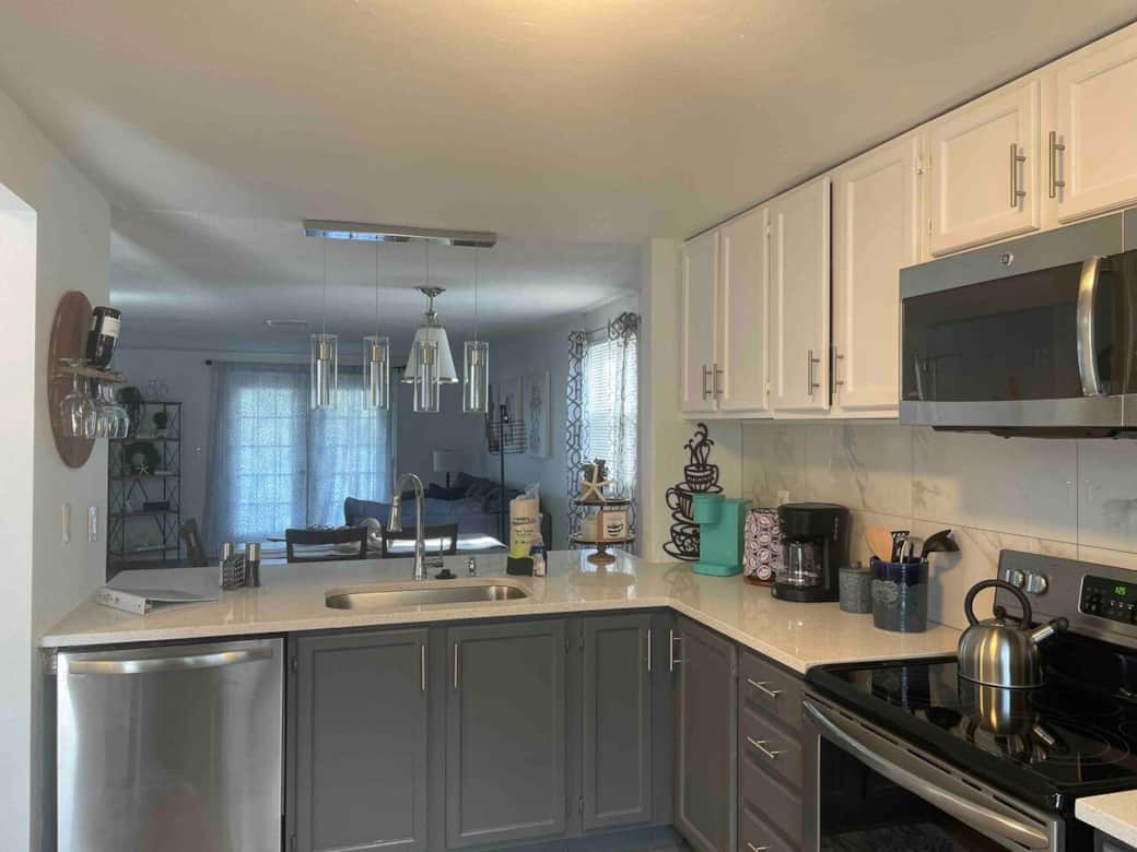 Spacious, modern kitchen with new appliances—open to dining and living for seamless gatherings.