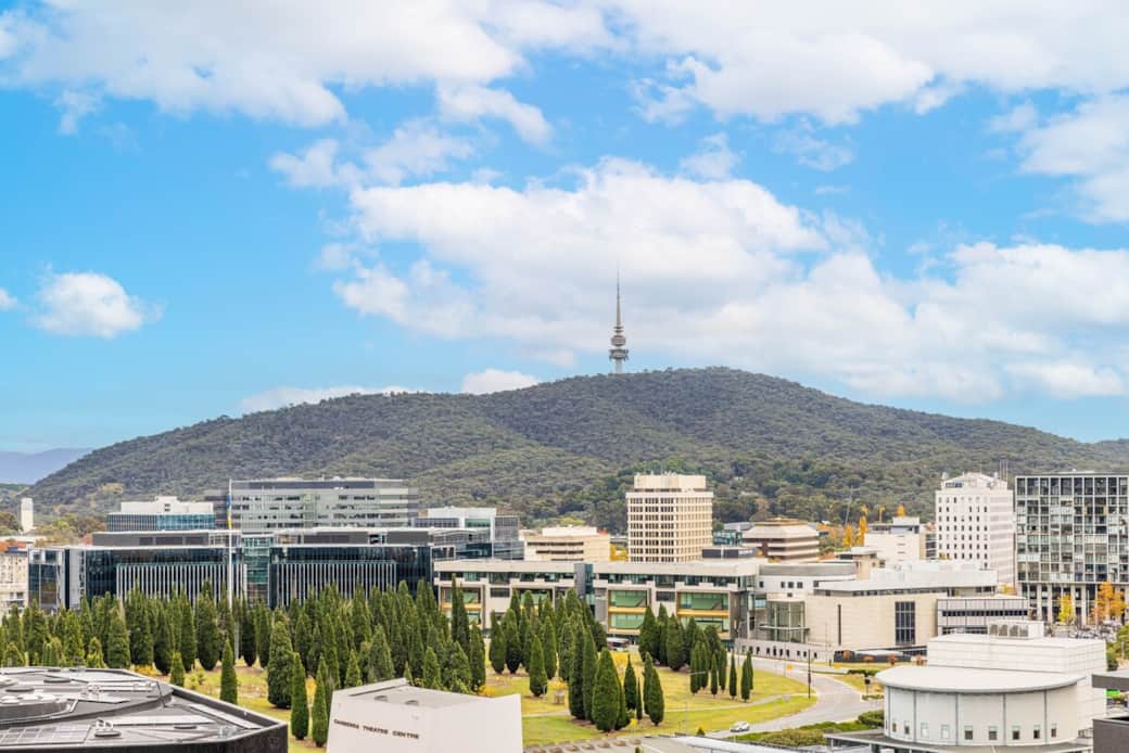  Capture the essence of the city with a backdrop of majestic mountains. This view from the property offers a harmonious blend of urban life and natural beauty, a sight to behold for all guests.