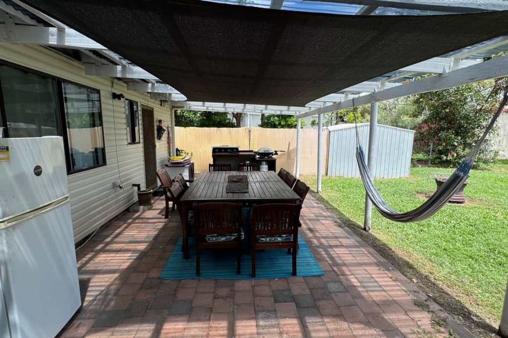 Right out back, we have a second fridge, two BBQs, and a spacious area for entertaining.