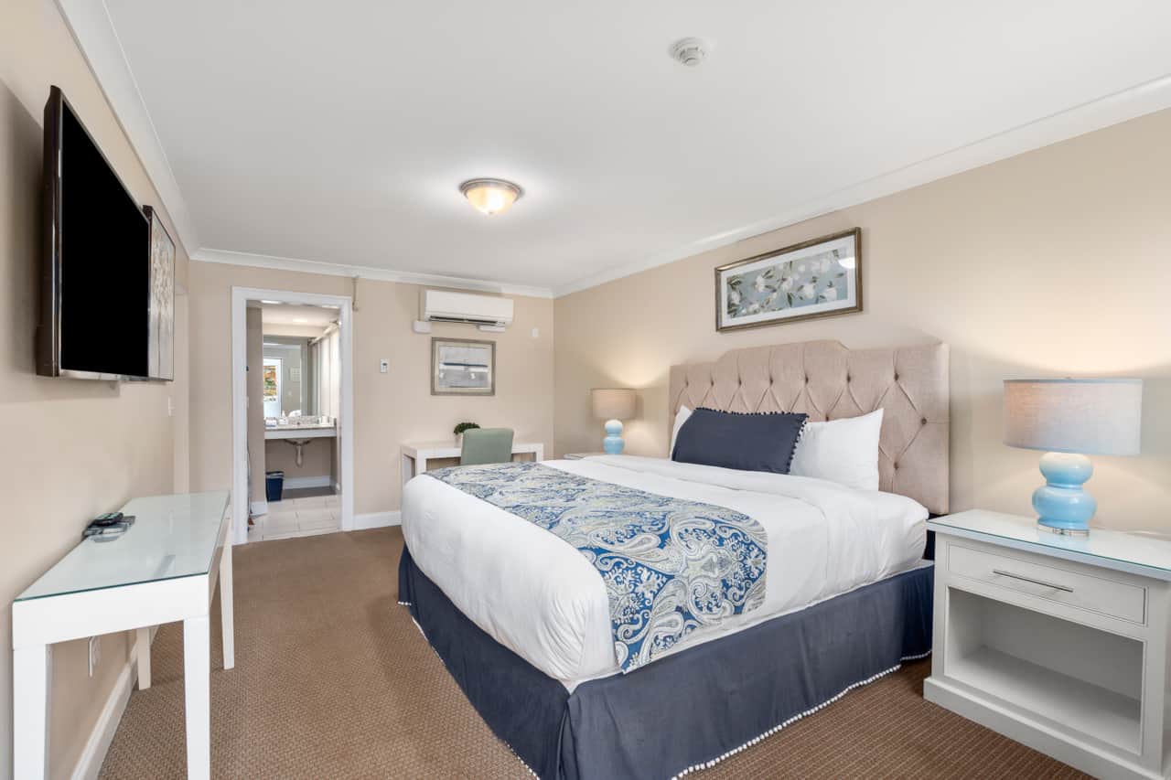 King bed with clean provided linens, private entrance, and a dedicated workspace
